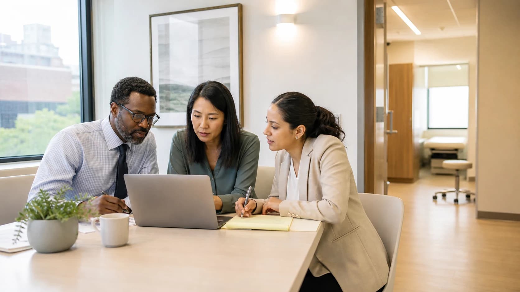 Illustrative diverse medical practice team reviewing a patient marketing plan in a Boston clinic